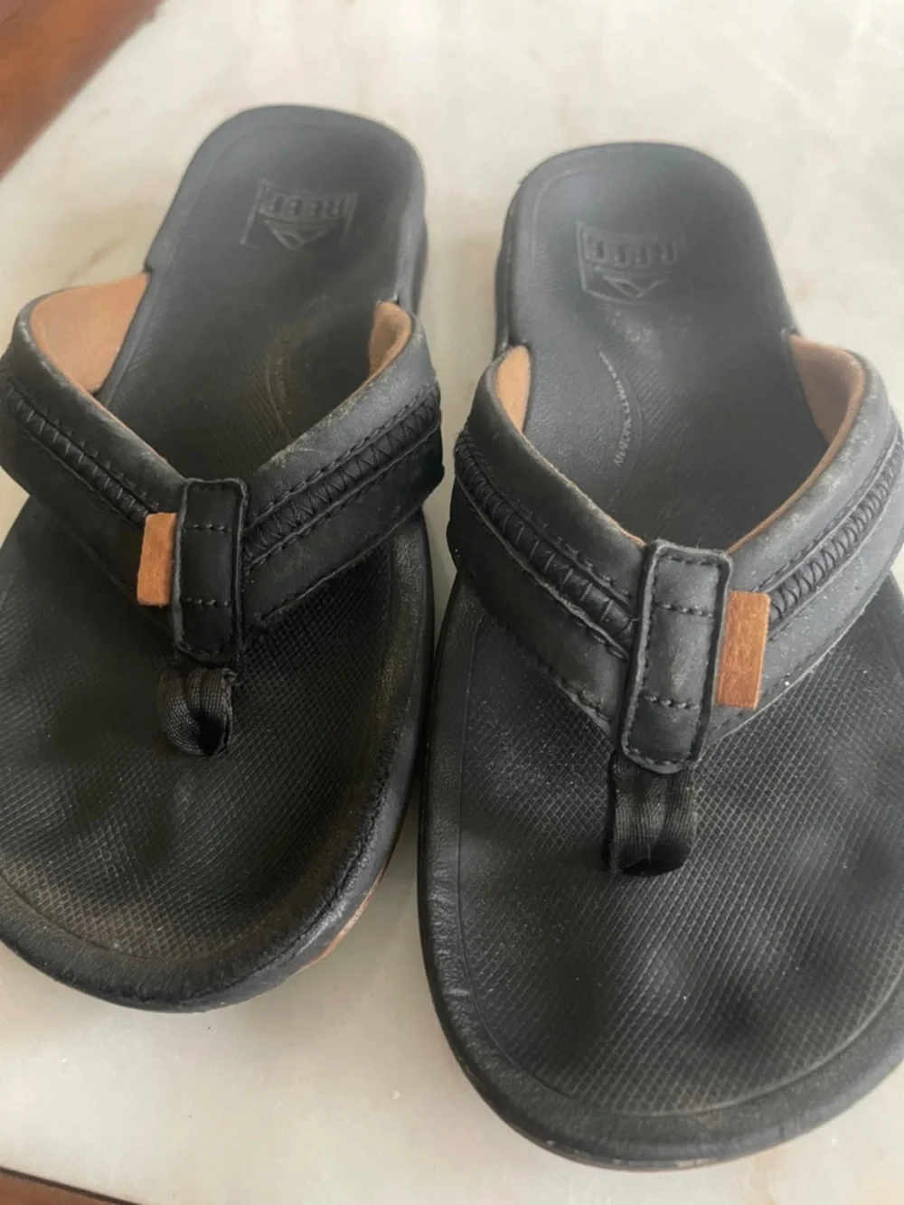 Reef Black Flip Sandals with Brown Accents